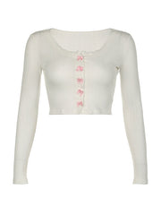 Top cardigan con fiocco angelico